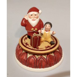 Santa Claus christmas music box with child. Collection music box is completely hand-painted and finished in an antique-style.